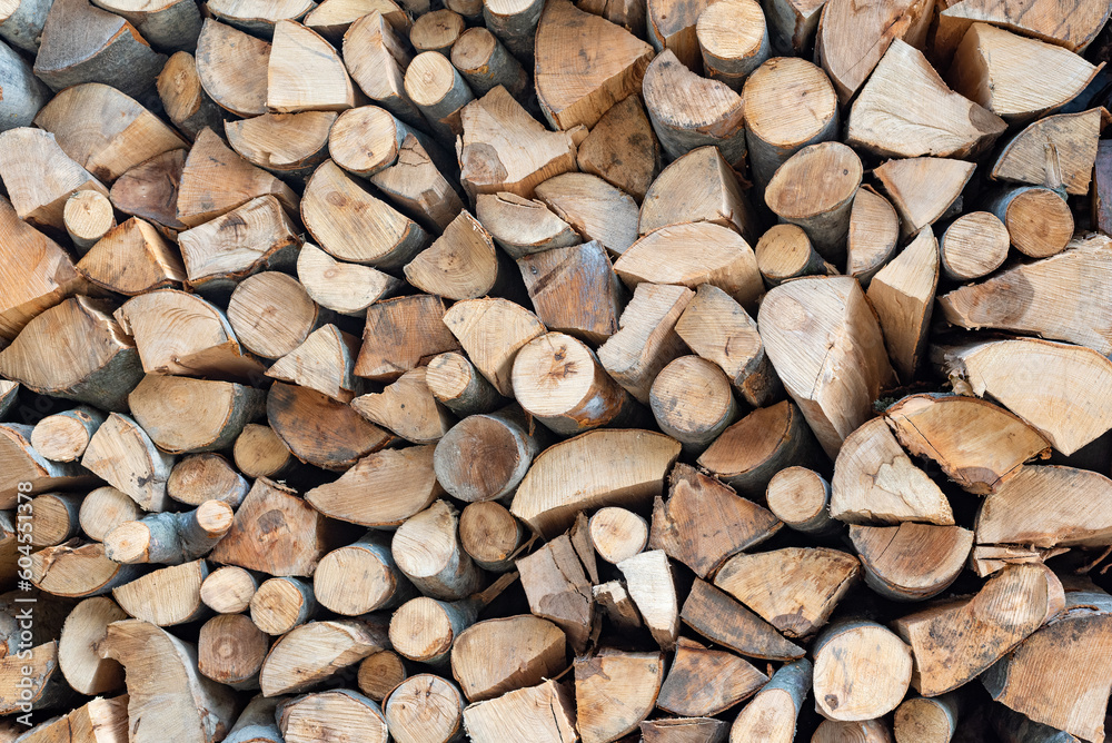 Harvesting chopped firewood. Abstract wooden background. Coarse wood Harvesting chopped firewood. Abstract wooden background. Coarse wood