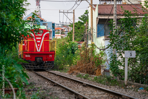 Incredible view of train passing through a narrow street, the Hanoi Old Quarter. Stock photo