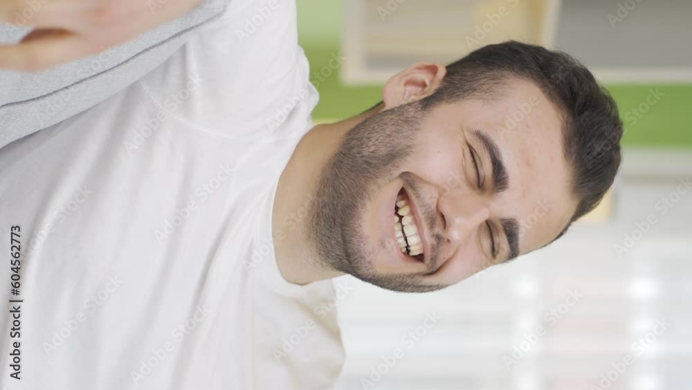 Vertical Video of Young man thinking about good days with pleasure. Vertical Video of Young man thinking about good days with pleasure.