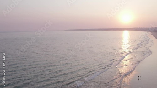 Aerial panoramic sunset seascape view of Salgados beach in Albufeira, at Algarve region, a Worldwide Popular Beach and Nature Destination, in South Portugal.