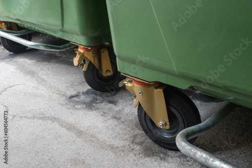 closeup description of heavy duty casters (large wheelie bins) stock images, selective focus.vienna, austria, 16 may 2023