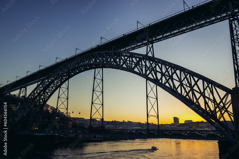 Sunset view with Dom Luis I Bridge connected cities of Porto and Vila Nova de Gaia in Portugal