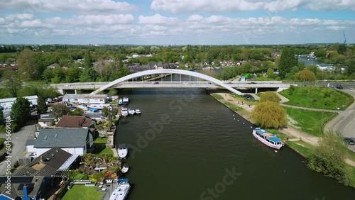 The drone aerial footage of Walton bridge across the Thames River, England, UK. Walton Bridge is a road bridge across the River, carrying the A244 between Walton-on-Thames and Shepperton.  photo