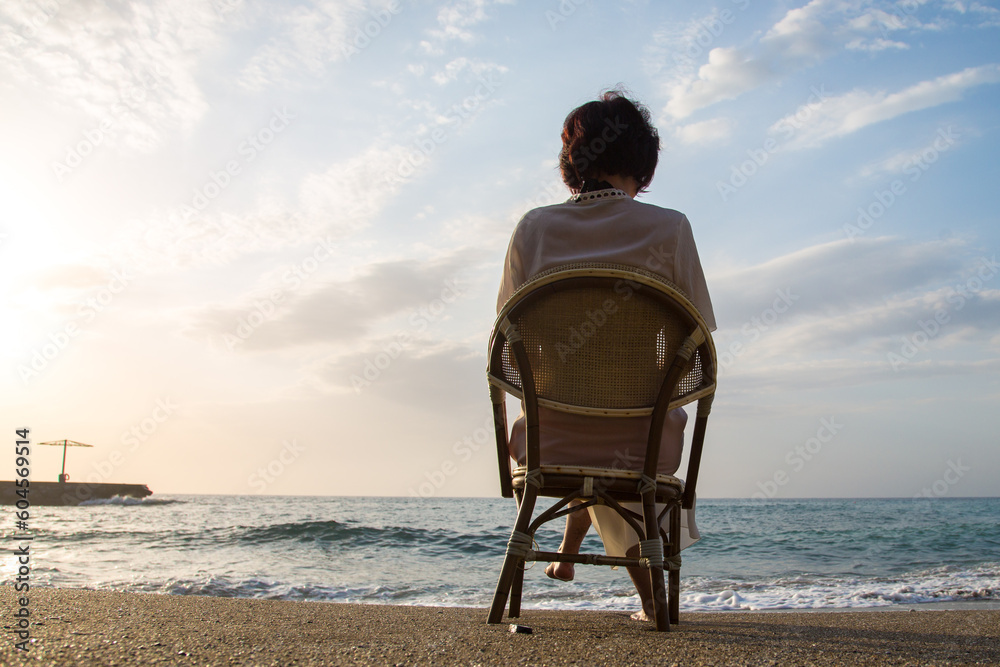 Fototapeta premium Lonely vacation by the sea, the concept of tranquility and enjoyment.
