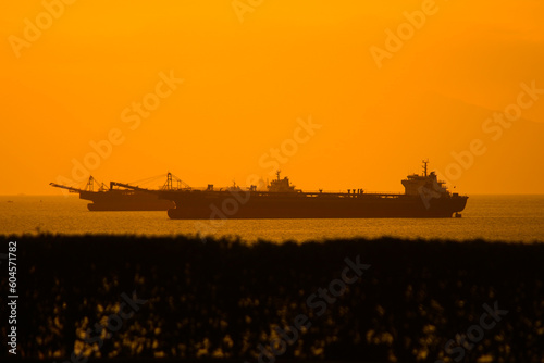 tanker at sunset, container vessel at the sea