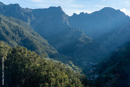 A breathtaking aerial view of the Madeira mountain range  showcasing its lush valleys and trees with tranquil plateaus. Nature at her finest 