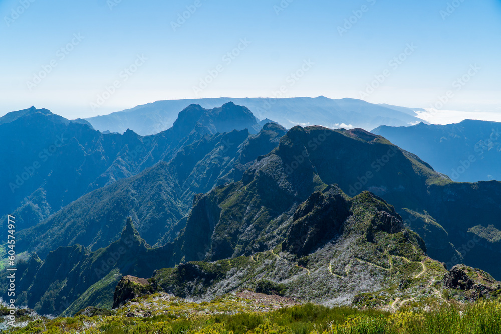 Fototapeta premium Overlooking a cloud inversion event while hiking the Pico do Ariero to Pico Ruivo mountain trail in Madeira, 2022