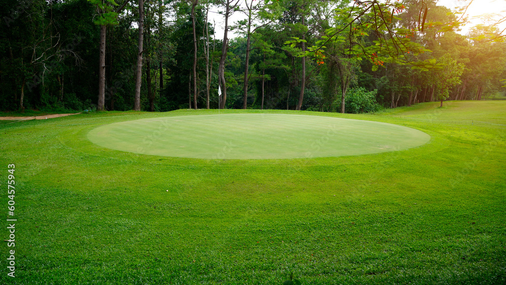 Beautiful golf course in a sunny day. Background evening golf course has sunlight shining down.