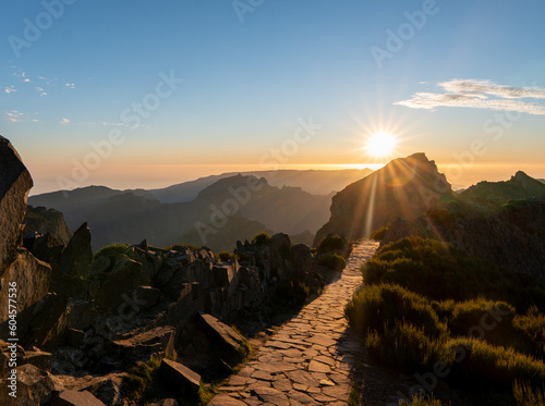 Mountain trail Pico do Arieiro, Madeira Island, Portugal Scenic view of steep and beautiful mountains and clouds during sunrise. October 2021 photo