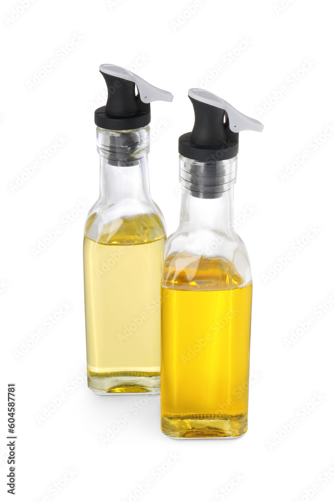 Glass bottles with cooking oil on white background Glass bottles with cooking oil on white background