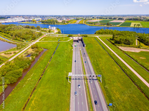 Obraz na płótnie High angle Drone Point of View on the Wijkertunnel in Beverwijk, North Holland, The Netherlands. It goes under the North Sea Canal and opened in 1996. w salonie
