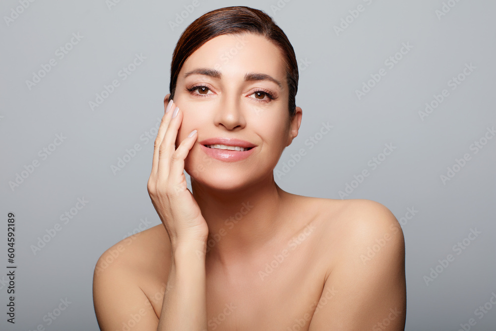 Skin care. Beautiful middle-aged woman with healthy flawless skin Skin care. Beautiful middle-aged woman with healthy flawless skin