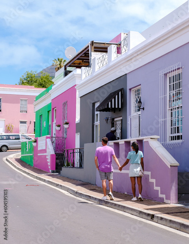 Bo Kaap Colourful street Township in Cape Town, is a colorful street with houses in South Africa. Bo Kaap or former Malay Quarter neighborhood, a couple of men and women on a city trip in Cape Town photo