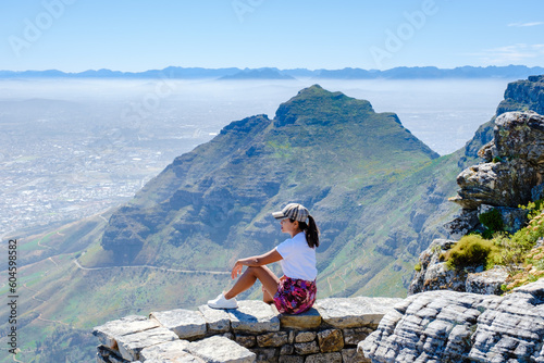 view from the Table Mountain in Cape Town South Africa, view over the ocean, and Lion's Head from Table Mountain Cape Town, Asian women hiking in the mountains of Cape Town South Africa