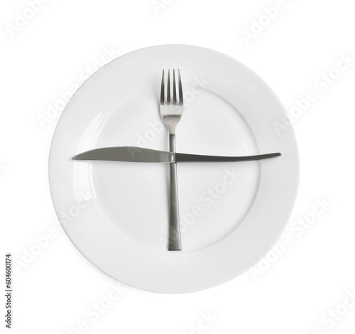 Ceramic plate  fork and knife on white background  top view