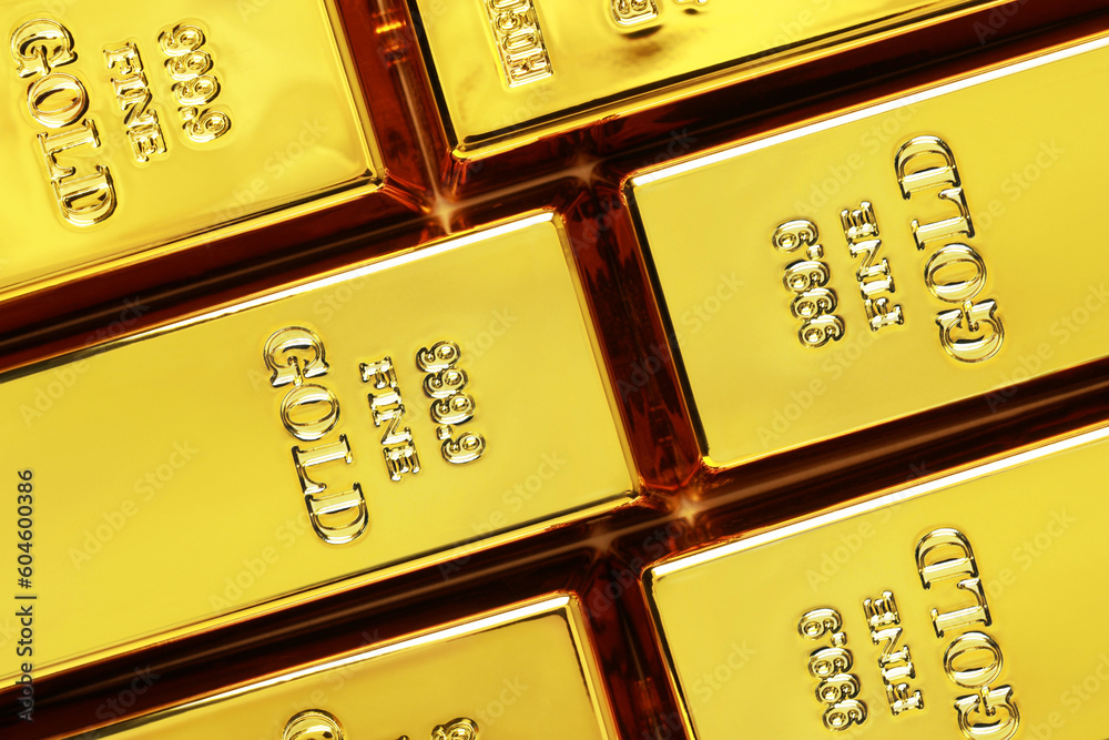 Many shiny gold bars as background, top view Many shiny gold bars as background, top view