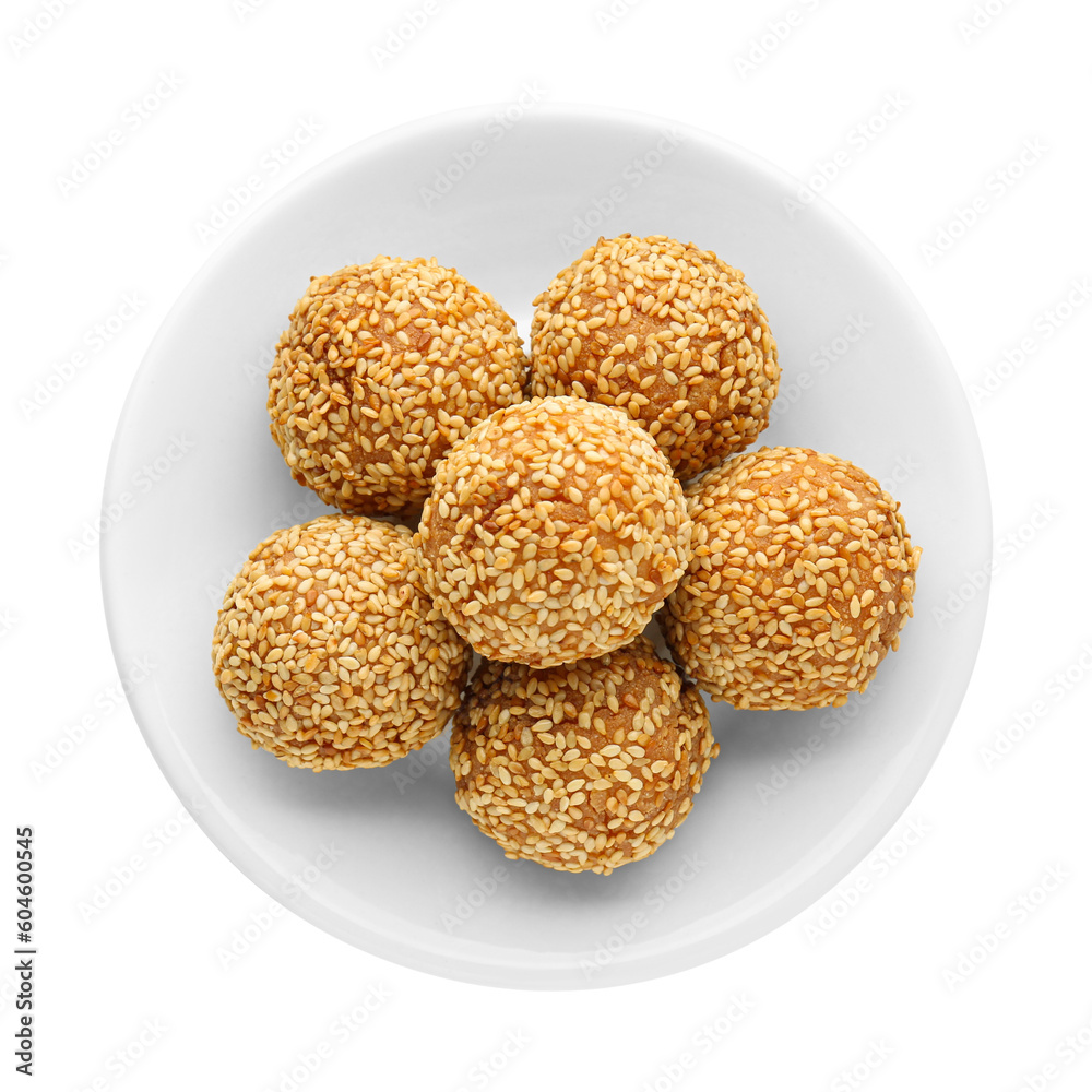 Plate of delicious sesame balls on white background, top view