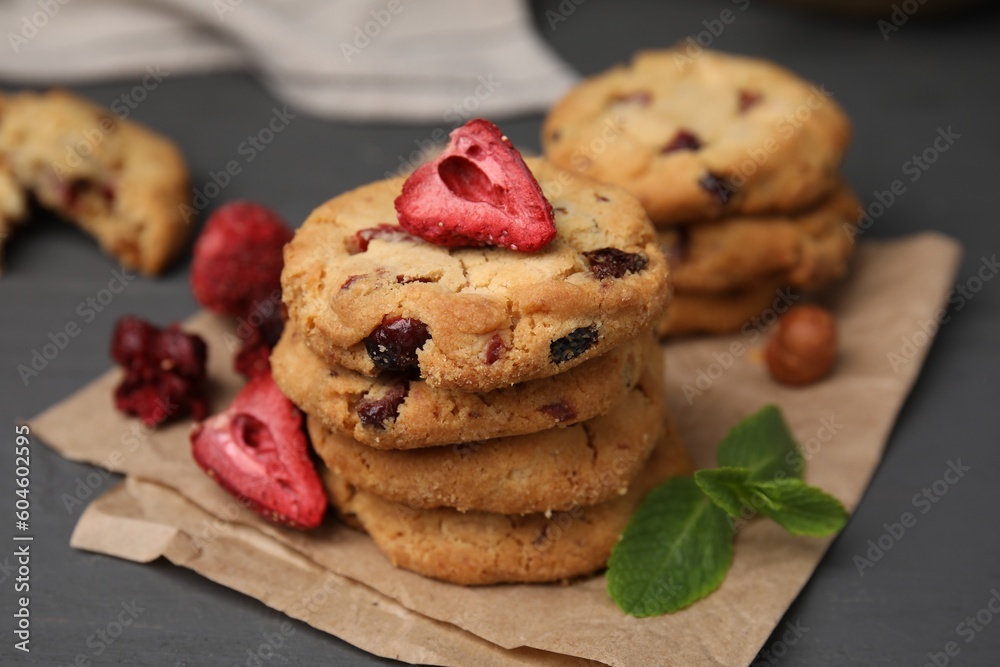 Cookies with freeze dried fruits and mint on grey table, closeup