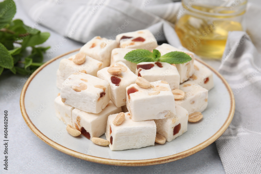 Pieces of delicious nutty nougat on light table Pieces of delicious nutty nougat on light table
