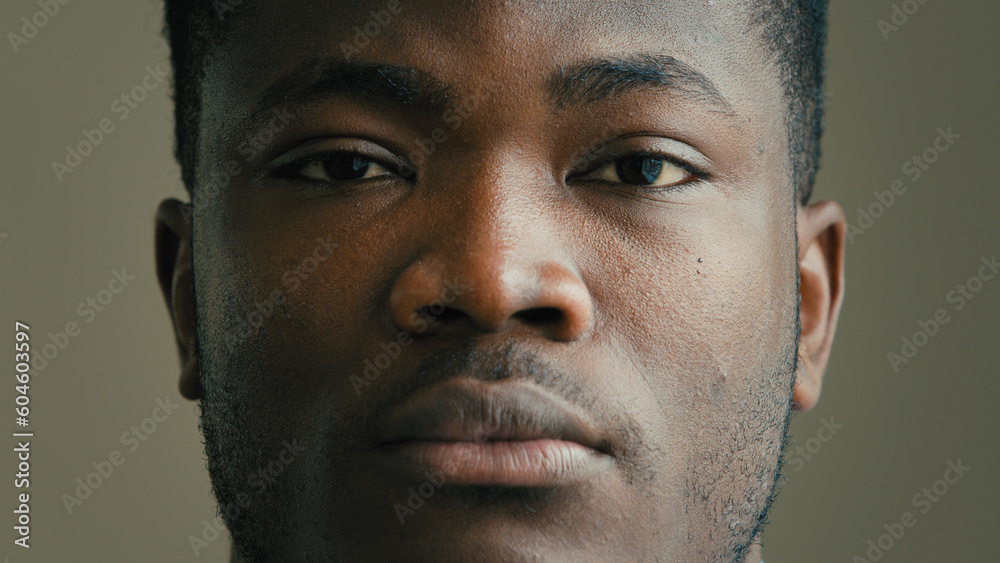 Obraz premium Close-up head shot african american ethnic man multiracial businessman adult 30s millennial looking at camera sad unhappy human facial emotion anxious depressed male patient of ophthalmology clinic