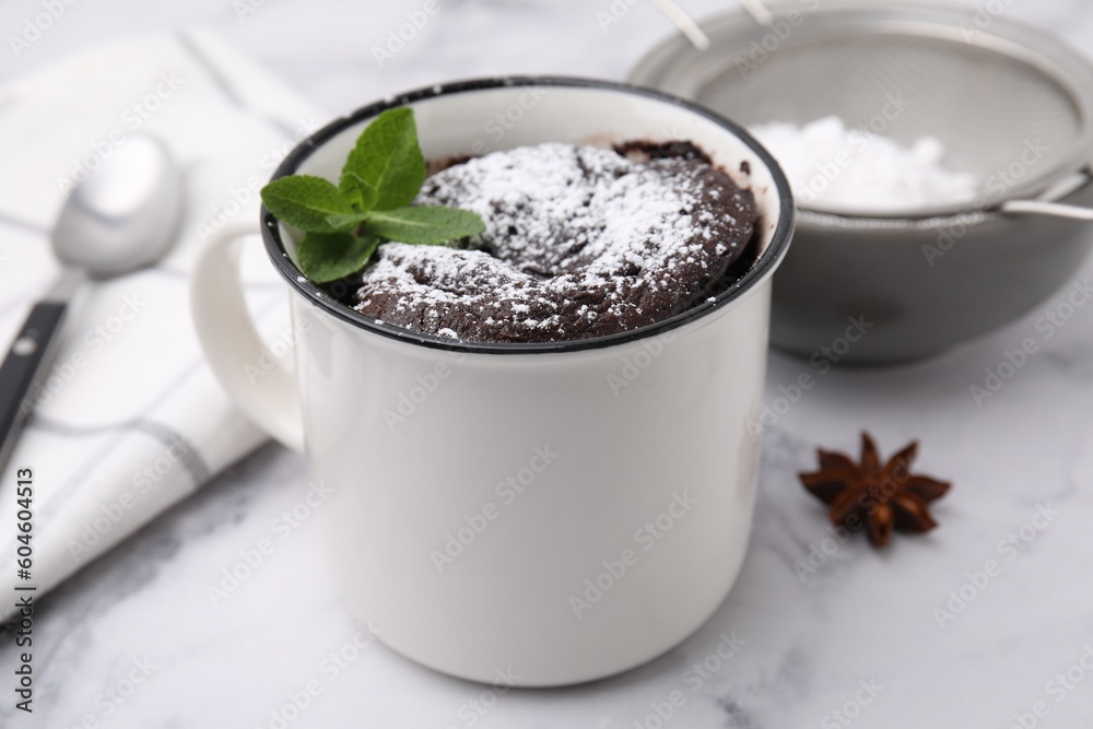 Tasty chocolate mug pie on white marble table, closeup. Microwave cake recipe Tasty chocolate mug pie on white marble table, closeup. Microwave cake recipe