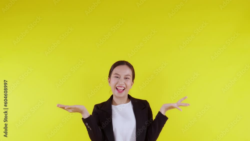 Portrait young asian business woman pointing and presenting isolated on yellow background, advertising and marketing, executive and manager, businesswoman confident showing something with expression.