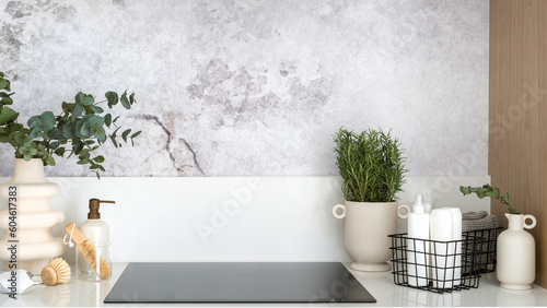 Foto professional detergent products near modern induction hob