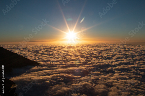 Sunset above the clouds