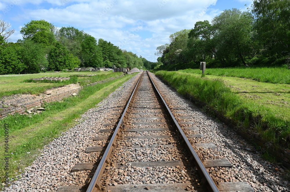 Looking down a single railway track towards a tunnel. Looking down a single railway track towards a tunnel.