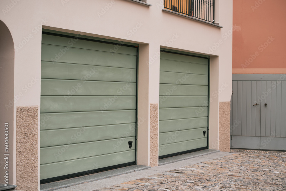 Garage door. Luxury and modern house with double garage door in Europe. Garage door. Luxury and modern house with double garage door in Europe.