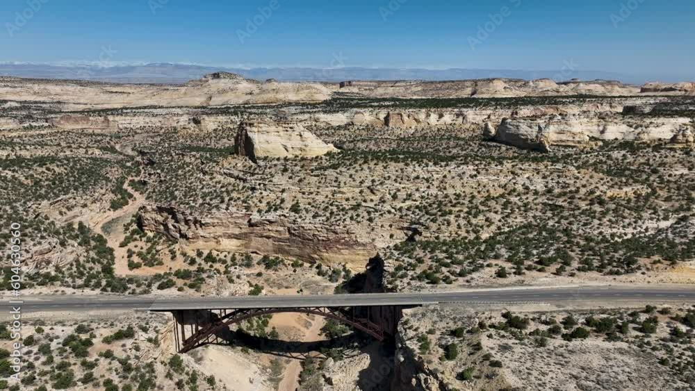 Aerial Eagle Canyon highway bridge traffic high fly over Utah 2. San Rafael Reef geologic landscape central Utah. Extreme recreation. Dangerous wilderness desert environment. Hikers, off road.