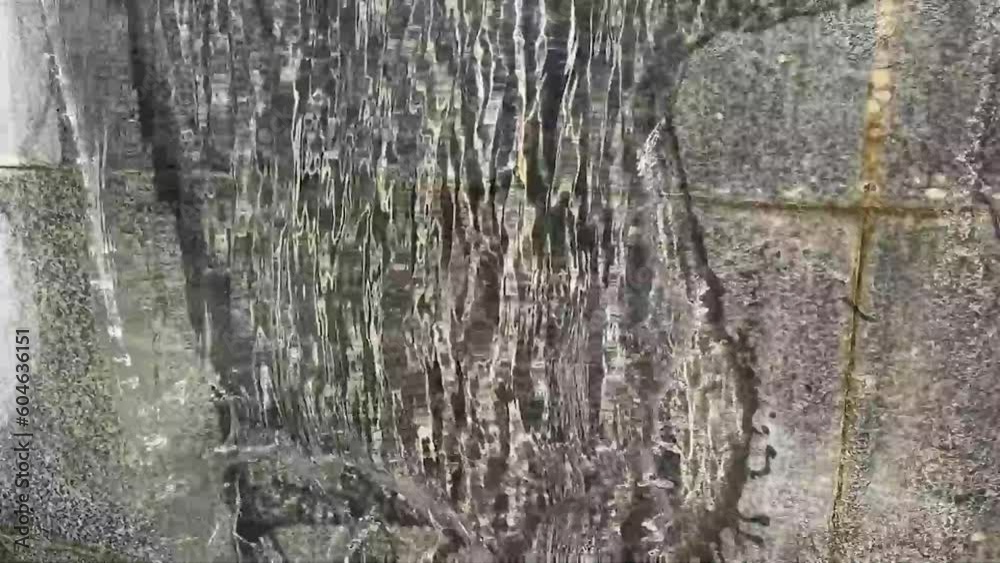 bubbling vertical fountain - waterfall in the city park bubbling vertical fountain - waterfall in the city park