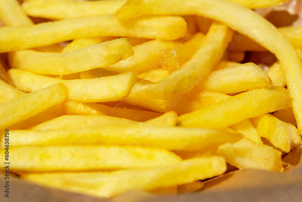 Fresh tasty fried french fries close up. Selective focus, defocus Fresh tasty fried french fries close up. Selective focus, defocus