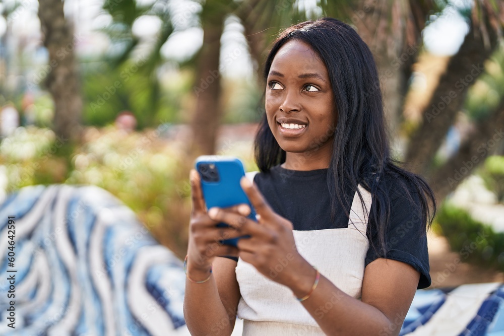 Young african american woman smiling confident using smartphone at park Young african american woman smiling confident using smartphone at park