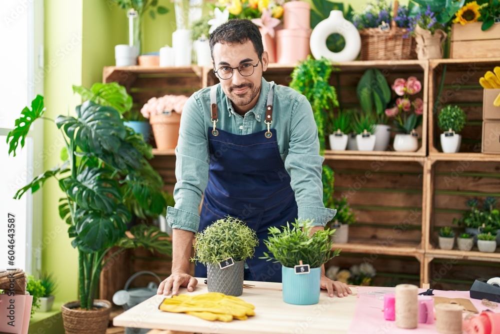 Young hispanic man florist smiling confident standing at flower shop Young hispanic man florist smiling confident standing at flower shop