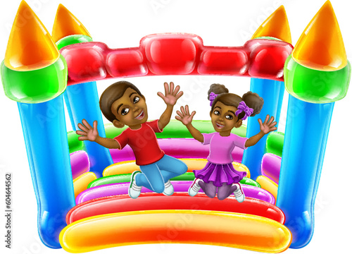 Children jumping and bouncing on a kids bouncy inflatable castle house