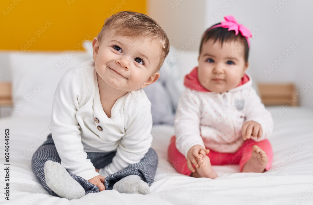Adorable boy and girl smiling confident sitting on bed at bedroom Adorable boy and girl smiling confident sitting on bed at bedroom