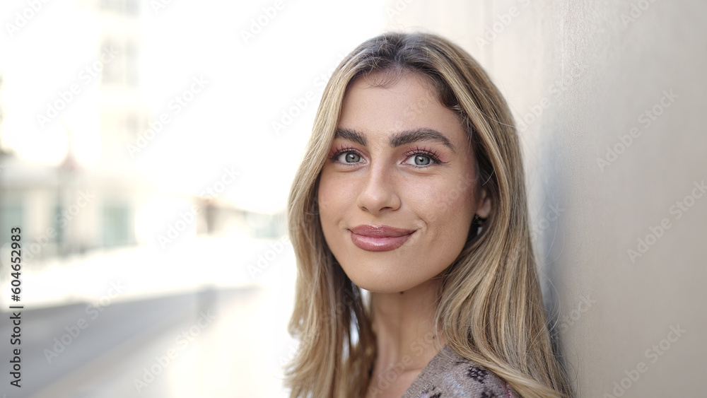 © Krakenimages.com - Young blonde woman smiling confident standing at street