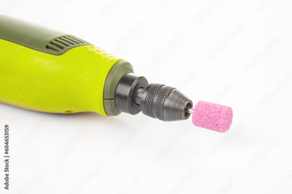 graver and drilling electric tool on a white background. dremel for processing materials and repairing parts graver and drilling electric tool on a white background. dremel for processing materials and repairing parts