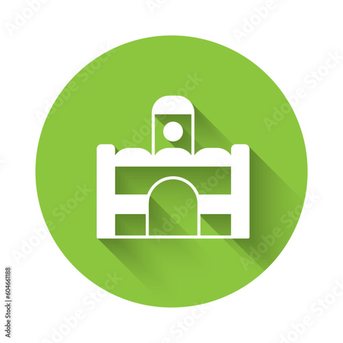 White Egyptian house icon isolated with long shadow background. Green circle button. Vector