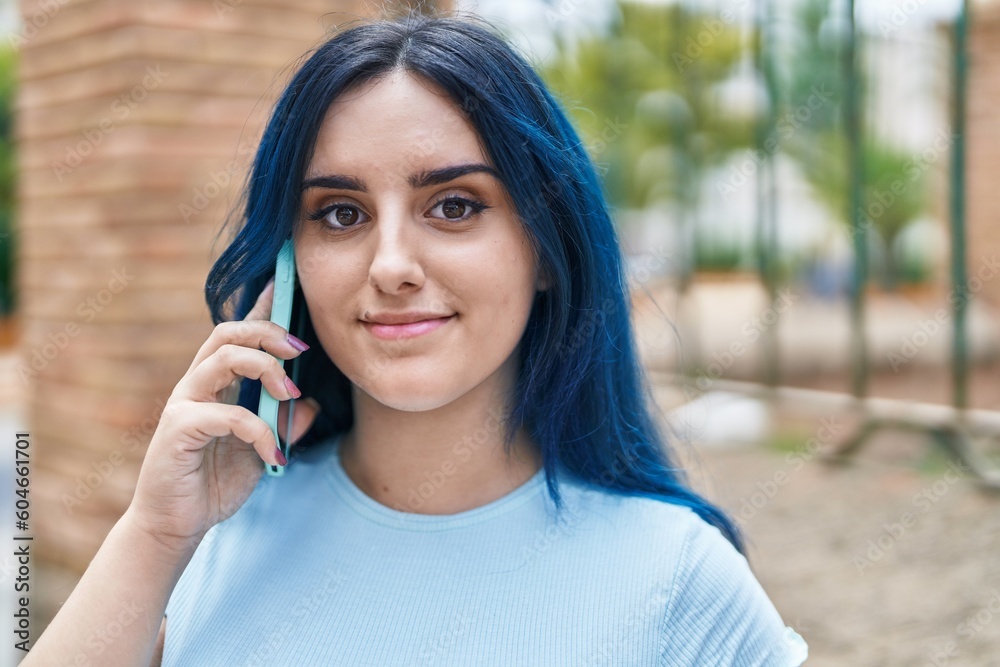Young caucasian woman smiling confident talking on the smartphone at street Young caucasian woman smiling confident talking on the smartphone at street