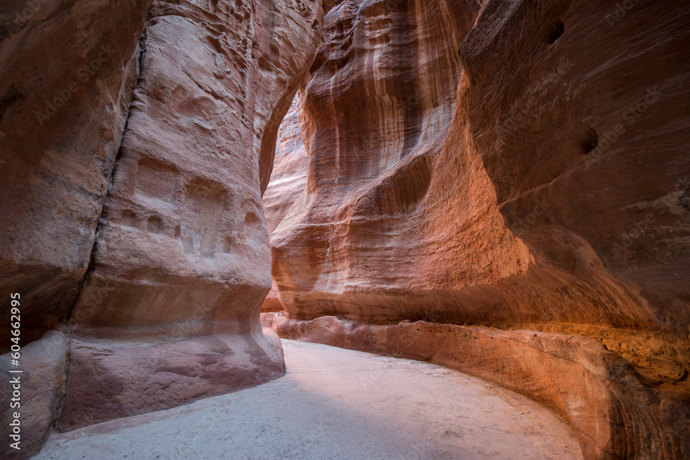 walking towards the Treasury in the gorge of the Siq, Petra, Jordan walking towards the Treasury in the gorge of the Siq, Petra, Jordan