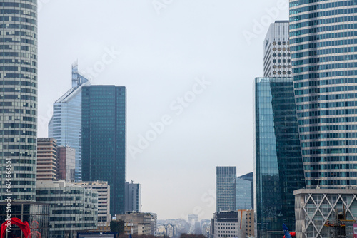 PARIS, FRANCE - DECEMBER 20, 2017: La Defense district skyline with Champs Elysees and Arc de Triomphe in the background. La Defense is the main business district of Paris and France, heaquarter to th