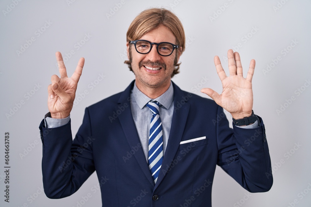 Caucasian man with mustache wearing business clothes showing and pointing up with fingers number seven while smiling confident and happy. Caucasian man with mustache wearing business clothes showing and pointing up with fingers number seven while smiling confident and happy.