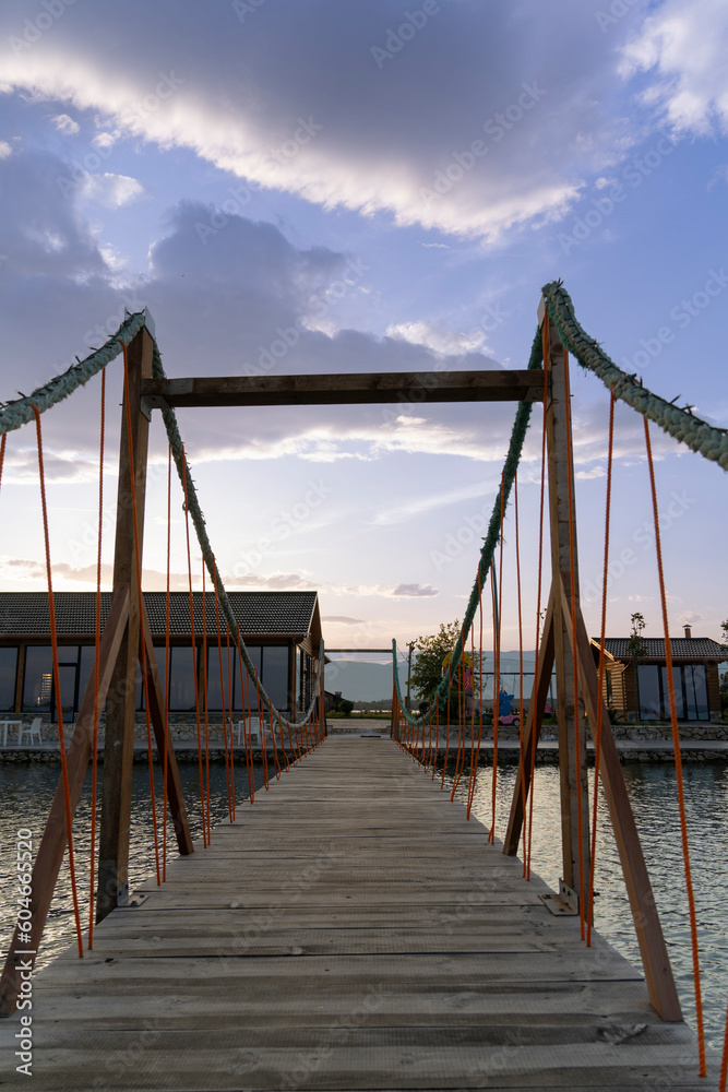 Albania Patoku Lagoon resorts,  bridge under a beautiful sky, sunrise