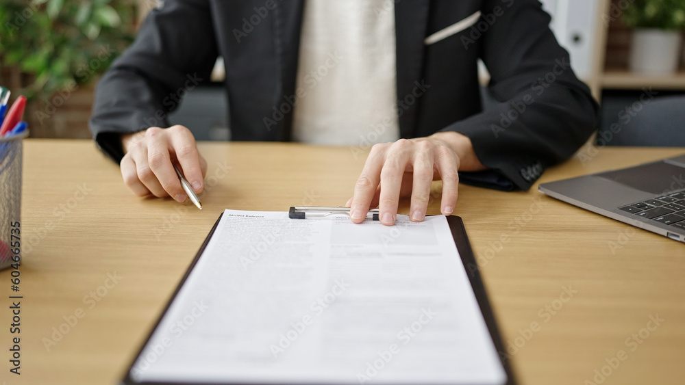 Young arab man business worker signing contract at office Young arab man business worker signing contract at office
