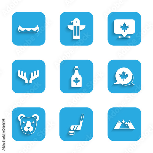 Set Bottle of maple syrup, Ice hockey stick and puck, Mountains, Canadian leaf, Bear head, Deer antlers, and Kayak icon. Vector