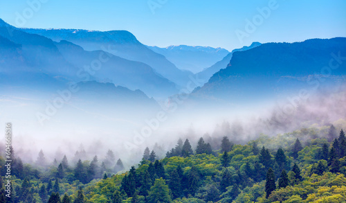 Beautiful landscape with blue misty silhouette of mountains 