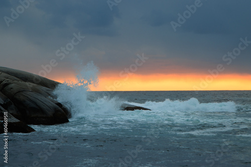 Waves crashing on rocky shore
