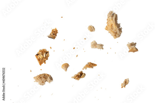 Crumbs of fresh whole grain bread isolated on white background. Isolate crumbs of different sizes for insertion into a design or project. photo
